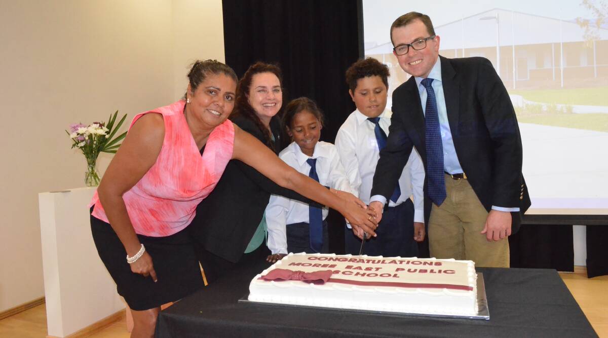 Unveiled: Moree East Public School executive principal Muriel Kelly, NSW Public Schools executive director Michelle Hall, Moree East Public School captains Shelby Briggs and Cody Picker and Northern Tablelands MP Adam Marshall cut the cake.