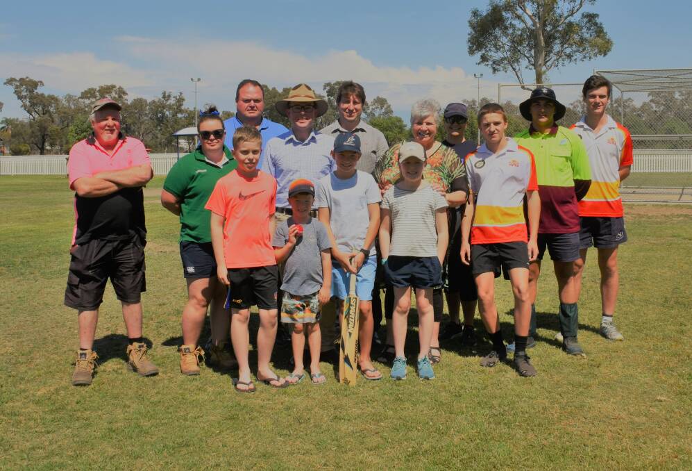 Sporting boost: Adam Marshall and Katrina Humphries with junior and senior cricket, netball and AFL representatives at Ron Harborne Oval. 