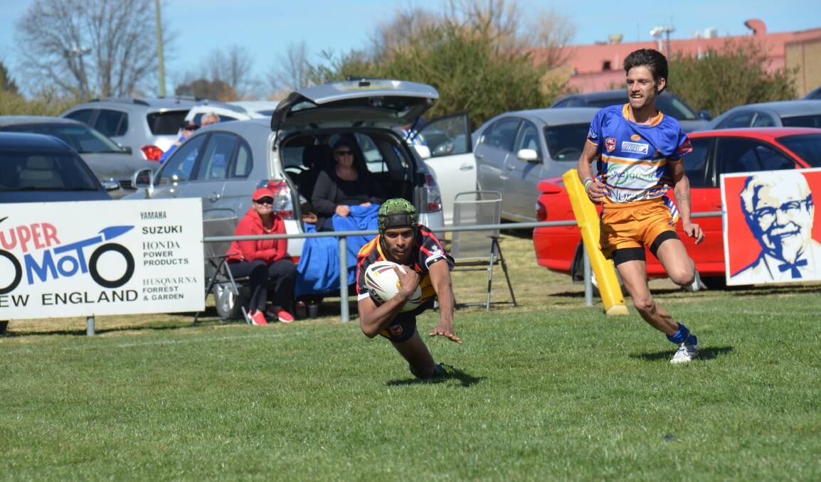 Reserve grade: Moree winger Silas Blackman-Haines dives for the try line after making a break from the sideline to score against Narwan in Armidale on Sunday. Photo: Ellen Dunger