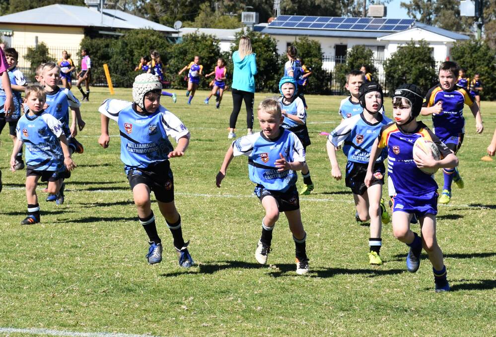 Junior league: Moses Humphries running the ball last year in the unders 8s against Guyra.
