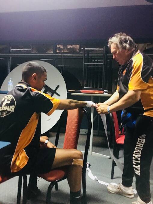 Moree's Brent Munro prepares for Saturday's bout with coach Danny Cheetham, of the Moree Boxing Academy.