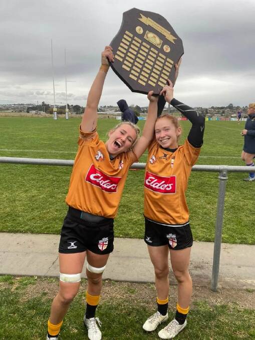Martha Harvey (right) celebrates with co-captain Charlie Norton after their thrilling one point win to claim the Grace Hamilton Shield.