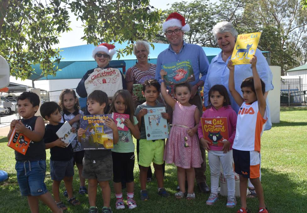 CHRISTMAS CELEBRATION: Councillor Kerry Cassells, Pius X Aboriginal Corporation CEO Donna Taylor, Northern Tablelands MP Adam Marshall and Moree mayor Katrina Humphries with Kiah Preschool students and their new books.
