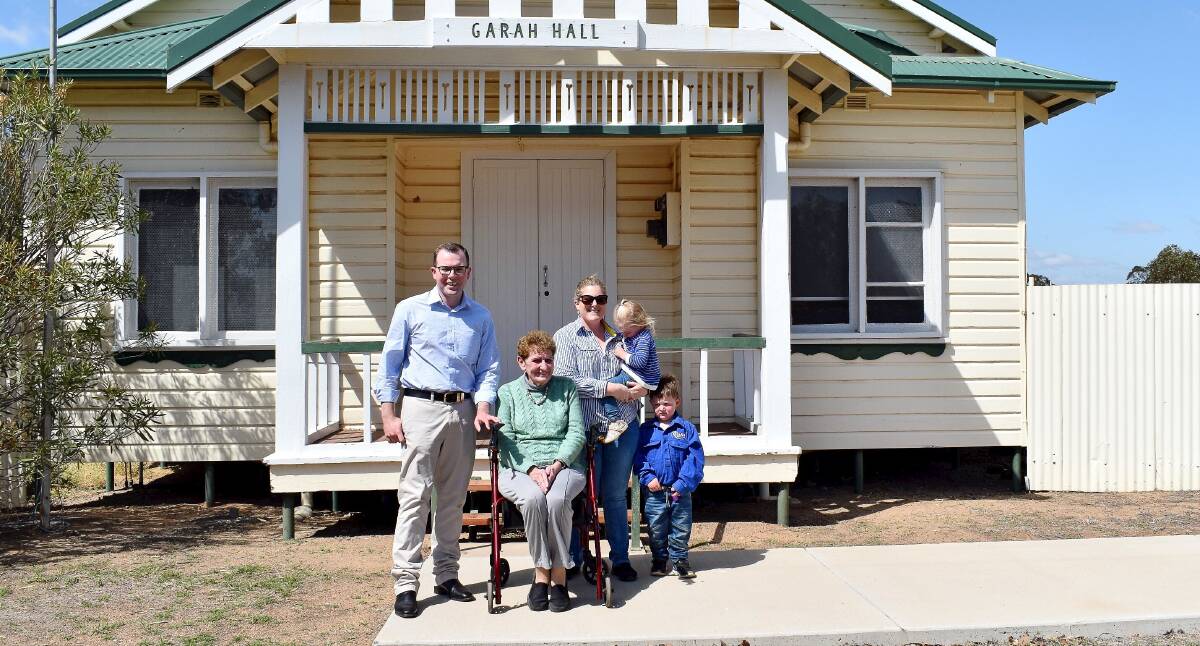 Northern Tablelands MP Adam Marshall, left, outside the Garah Community Hall with locals Bev Verney, Preschool committee member Jess Verney and her son Duke and daughter Stella. 