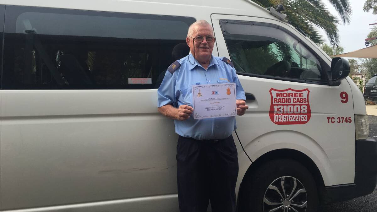 WELL-DESERVED: Darrel Bird receives his Customer Service Appreciation award for the extra care and effort he puts into his job as a taxi driver.