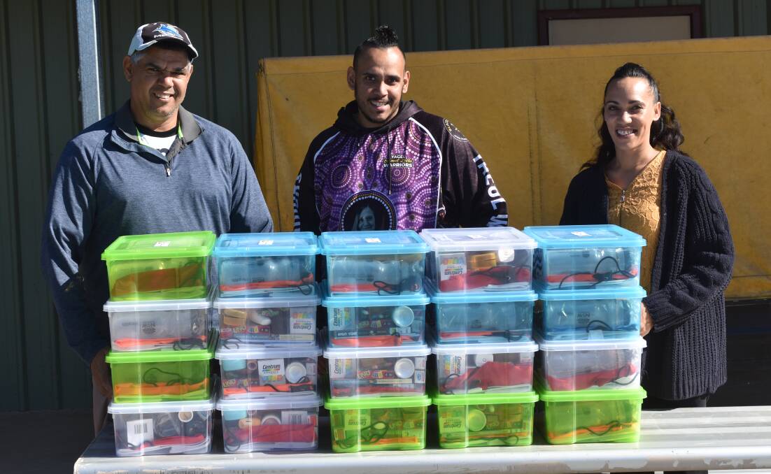 TAKE CARE: Miyay Birray CEO Darrel Smith and staff members James Smith and Jameela Boney with the self care kits that will be handed out to the community.