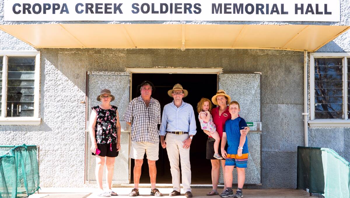Croppa Creek Hall Committee members Cheryl and Lawrie Timmons, left, Northern Tablelands MP Adam Marshall and hall committee treasurer Carolyn Bellman with her children Matilda and Oliver outside the iconic Croppa Creek Soldiers’ Memorial Hall.