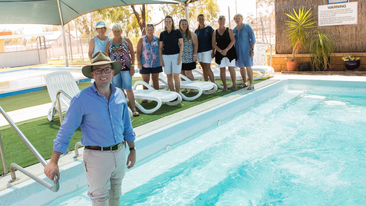 BOOMI BOOST: Northern Tablelands MP Adam Marshall gets his feet wet at the Boomi Artesian Baths to celebrate a funding windfall for the community with Jose Oates, left, Lola McDonald, Donna Adams, Nell Smith, Susie Perryman, Debbie Rutland and Wendy Carrigan.