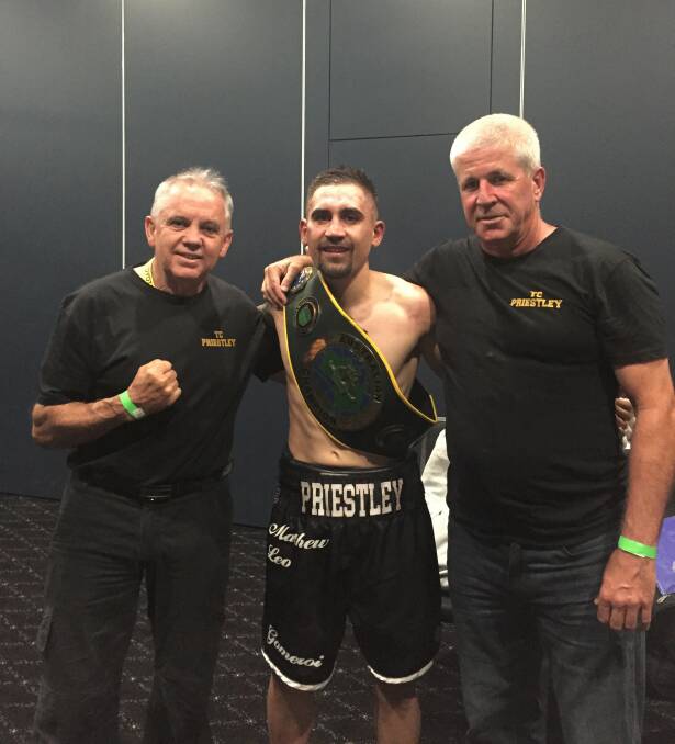 TC Priestley with Moree Boxing and Fitness coach Colin 'Chalky' Rice (left) and coach Mark Pitts (right) after winning the Australian Super Featherweight title in April.