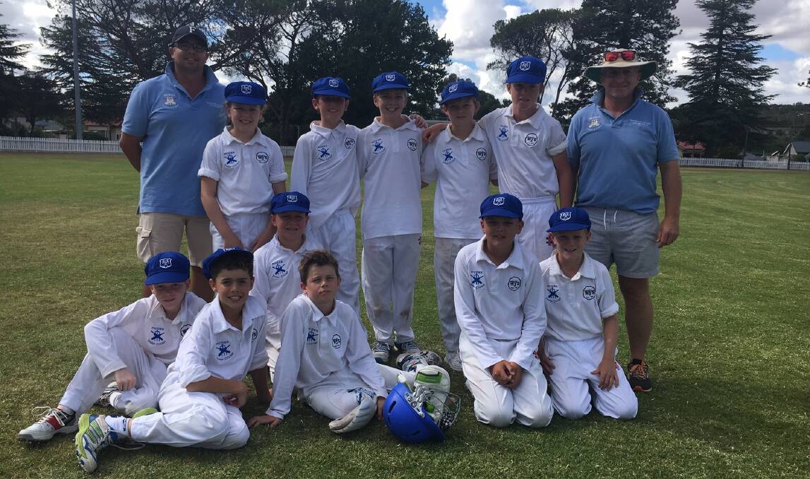 WINNERS: The Moree under 12s cricket team players and coaches celebrate getting through to the grand final after their win over Armidale
