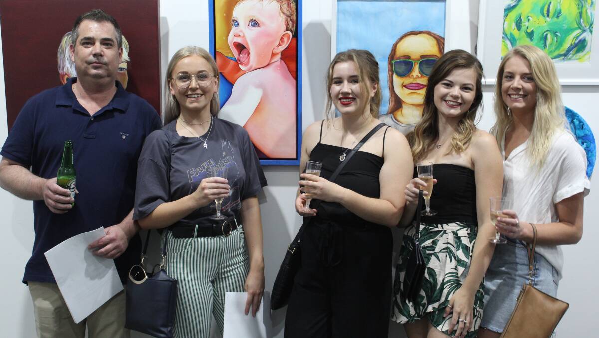 2018 grand Prize winner Amy Canfield (second from left) and her friends Dean Griffiths, Hannah Carrie, Laura Hall and Sidnee Crawford pictured with Amy's winning portrait 'Dreaming to meet you' at last year's opening of the Moree Portrait Prize.