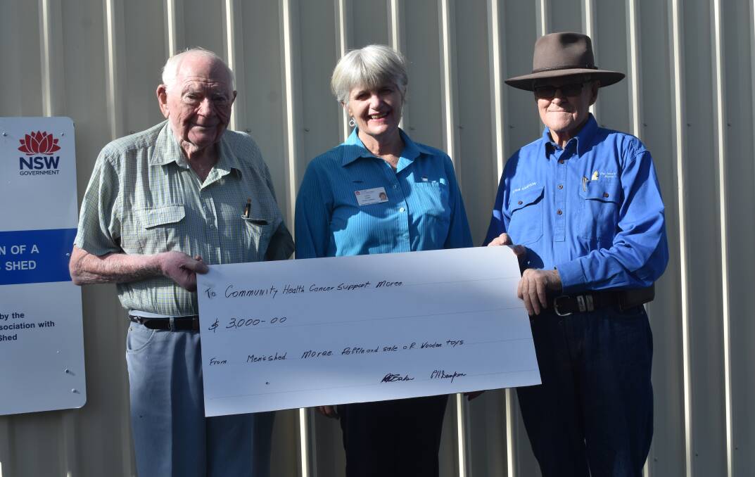 Cancer Support social worker Jann Tuart (centre) is presented a cheque for $3,000 by Moree Men's Shed founding member Don Quast and president Peter Sampson.