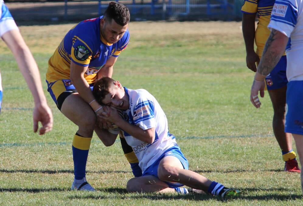 Luke McDonald wrestling with a Narwan Eels opponent, McDonald was one of two juniors to step up and help the A-grade side on Saturday. Photo: Steve Green.