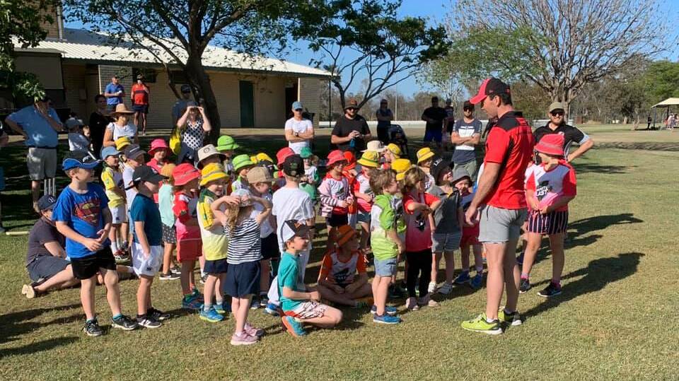 Vinnie Cameron from Cricket NSW runs the Junior Blaster program for a large group of excited, young cricketers. Photo: Moree Junior Cricket.