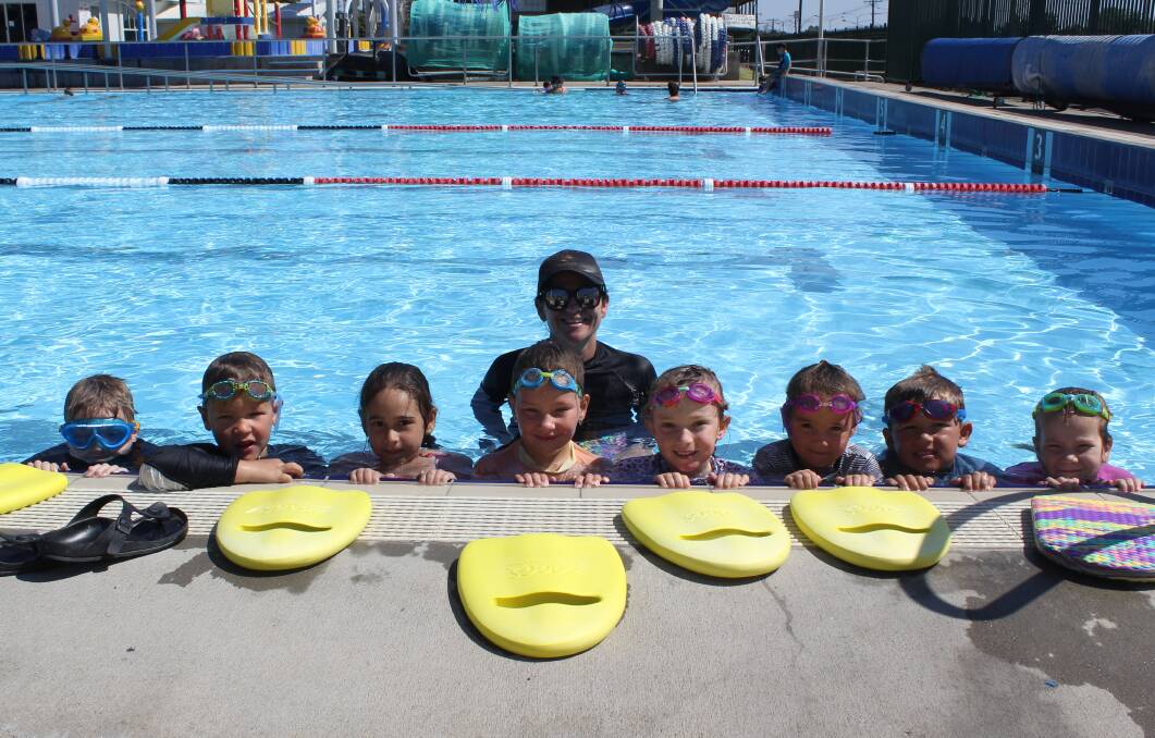 Marlin group learn to swim participants Mitchell Buckman, Riley McKibin, Olivia Bouliopoulos, Miley Kennedy, Addie and Poppy Strahan, Isaac Jackson and Chloe Muggleton with teacher Belinda Cicchelli at last year's holiday intensives.