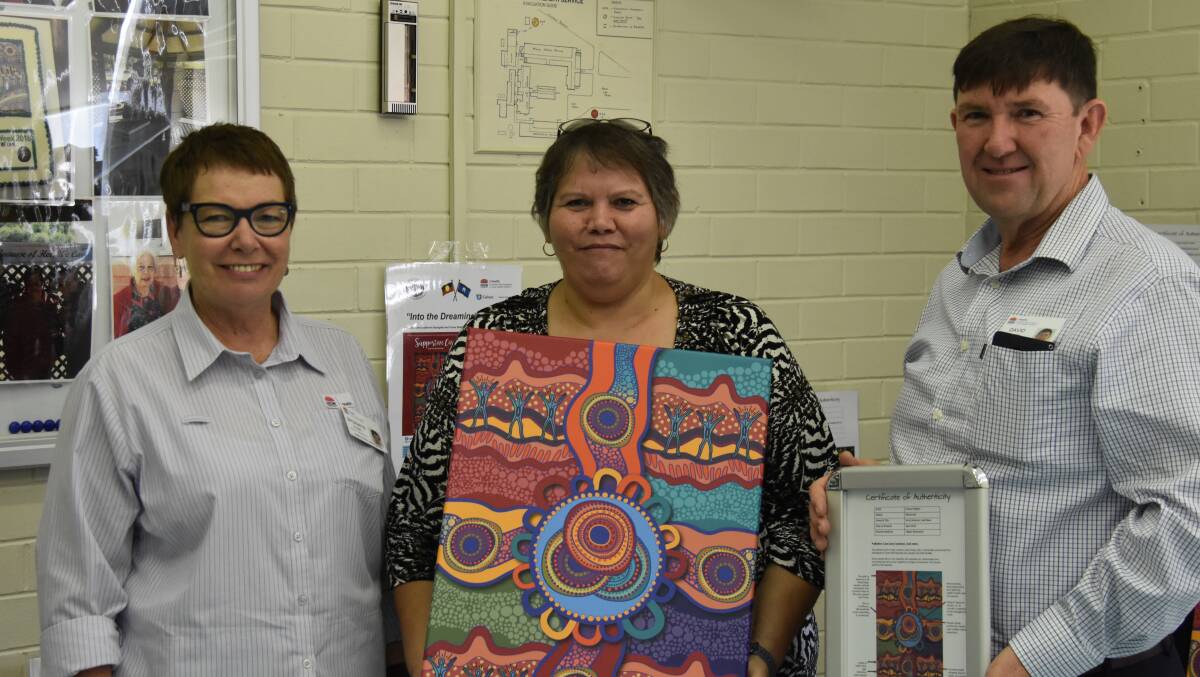 INTO THE DREAMING: HNELHD acute service manager Bronwyn Cosh, Aboriginal Healt Unit coordinator Mehi and West Peel Sectors Candice Dahlstrom and HNELHD Mehi sector general manager David Quirk with the artwork that will be used with palliative care