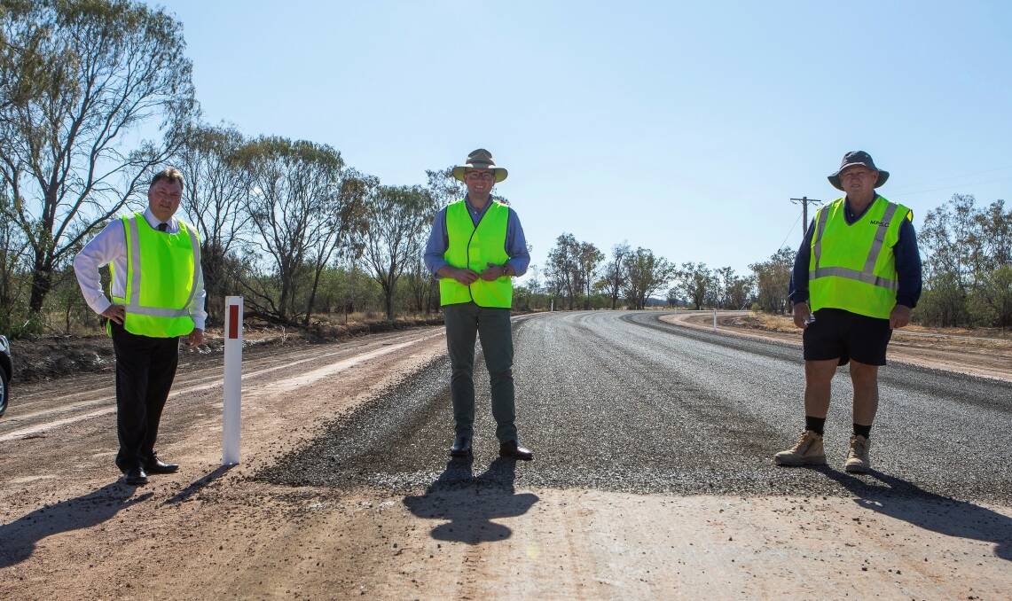 Moree Plains Shire Council general manager Lester Rogers, Northern Tablelands MP Adam Marshall and Councils Unsealed Roads Ganger Wayne Andrews inspecting freshly laid bitumen on Carrigan Road, about halfway between Boomi and Mungindi.
