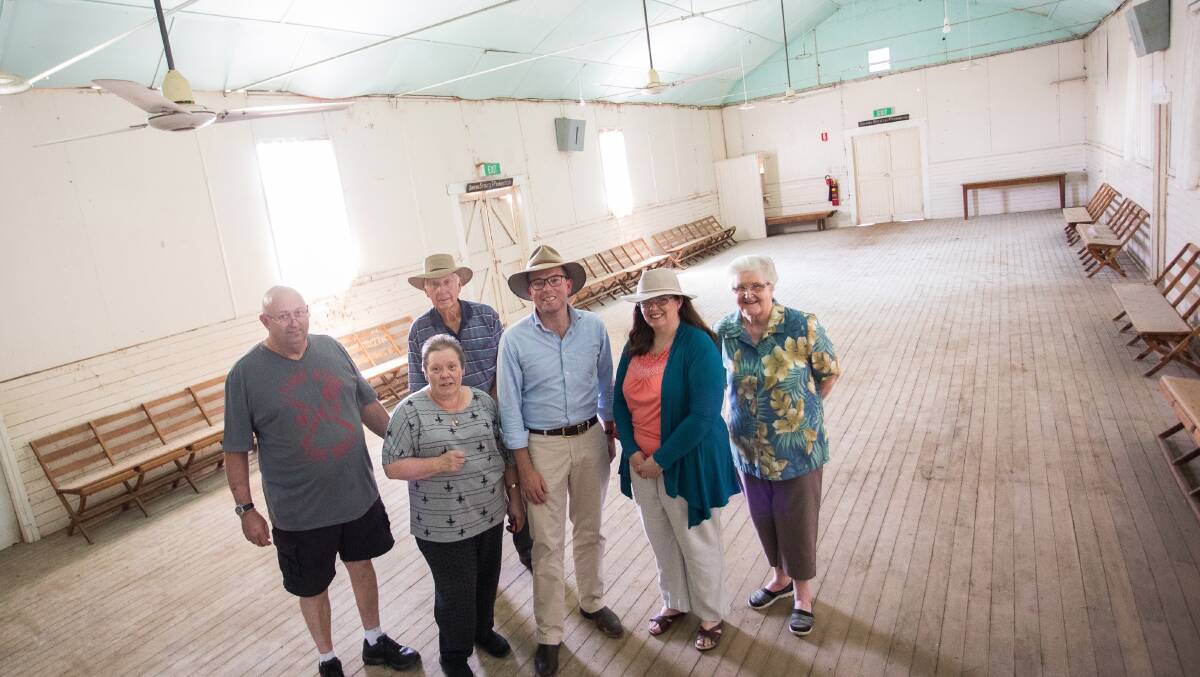 REVIVED: Stumping up some cash for a re-stumping effort in the old Gravesend Hall. Gravesend General Store owners Jeremy Mason and Deb Grant, left, long-time Gravesend resident Ken Withers, Northern Tablelands MP Adam Marshall, Gravesend Community Group Treasurer Karen Withers and Patricia Withers.