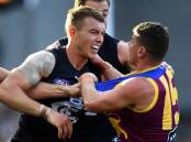 Carlton's Patrick Cripps tangles with Dayne Zorko in the Blues' at-times heated loss to Brisbane. (Jono Searle/AAP PHOTOS)