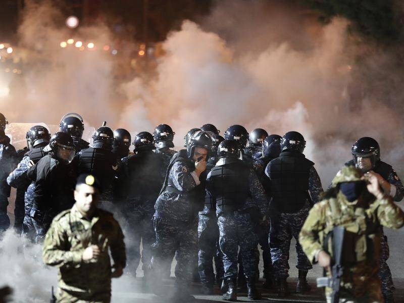 Riot police have fired tear gas at anti-government protesters in Beirut