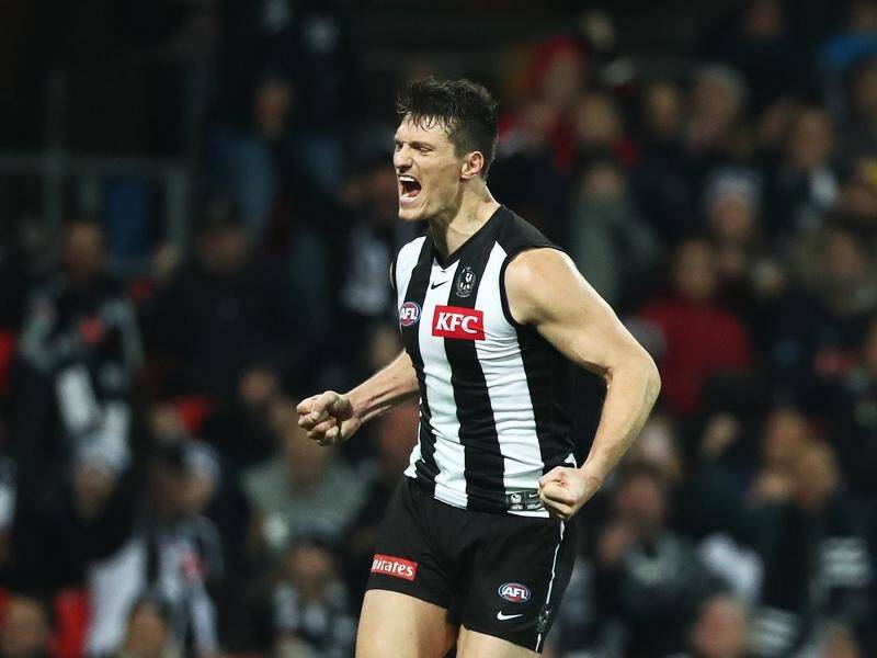 Magpies' Brody Mihocek scored as Collingwood won a sixth successive AFL match, beating Gold Coast .