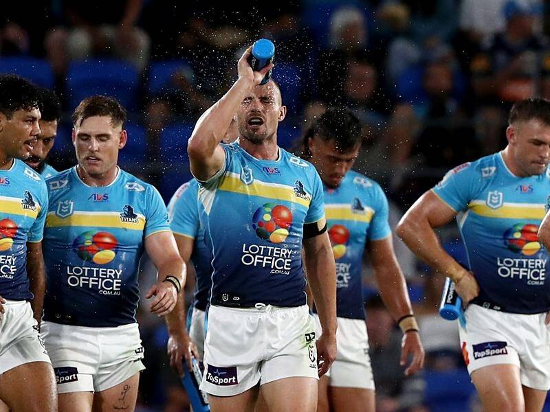 Gold Coast captain Kieran Foran (centre) is in top form and keen to play on in 2025. (Jason O'BRIEN/AAP PHOTOS)