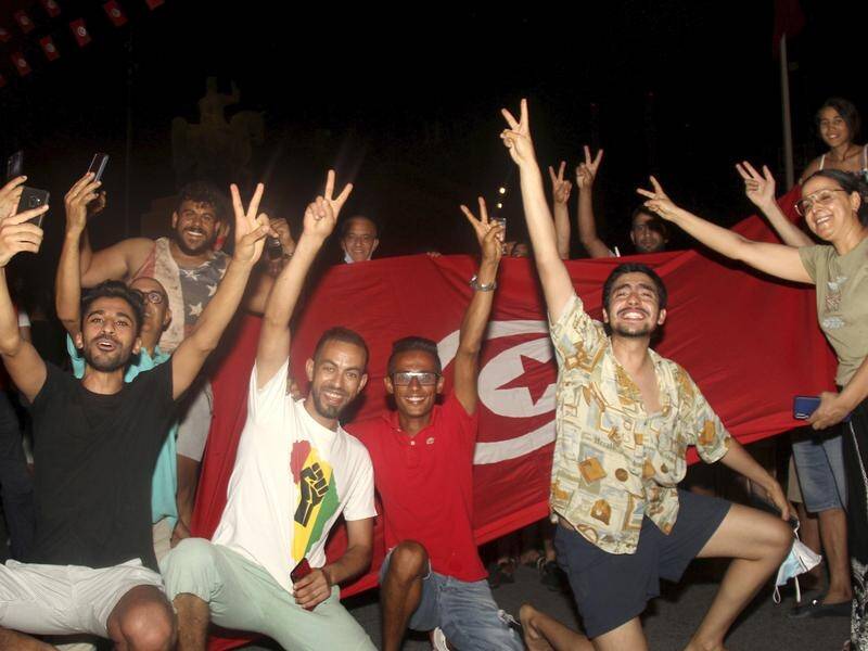 Supporters of Tunisia President Kais Saied have welcomed his decision to suspend parliament.