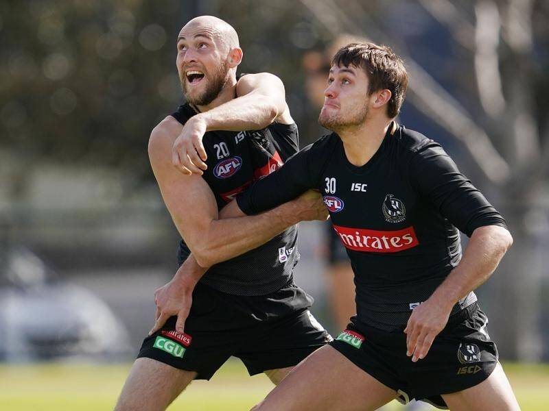 Darcy Moore (right) is confident Ben Reid (left) can make a successful AFL comeback against GWS.