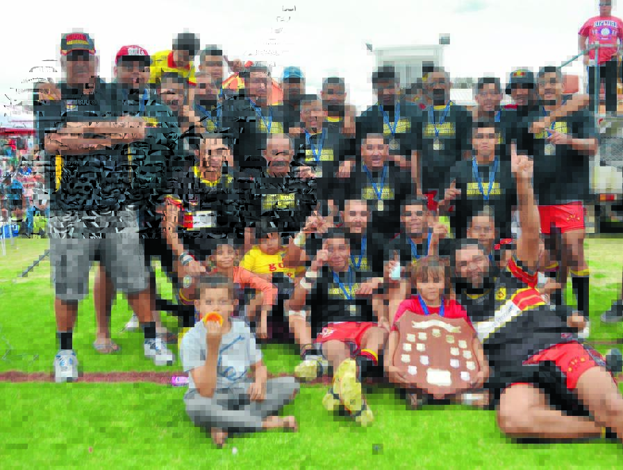 The Boomerangs reserve grade team celebrates their grand final win on Sunday.