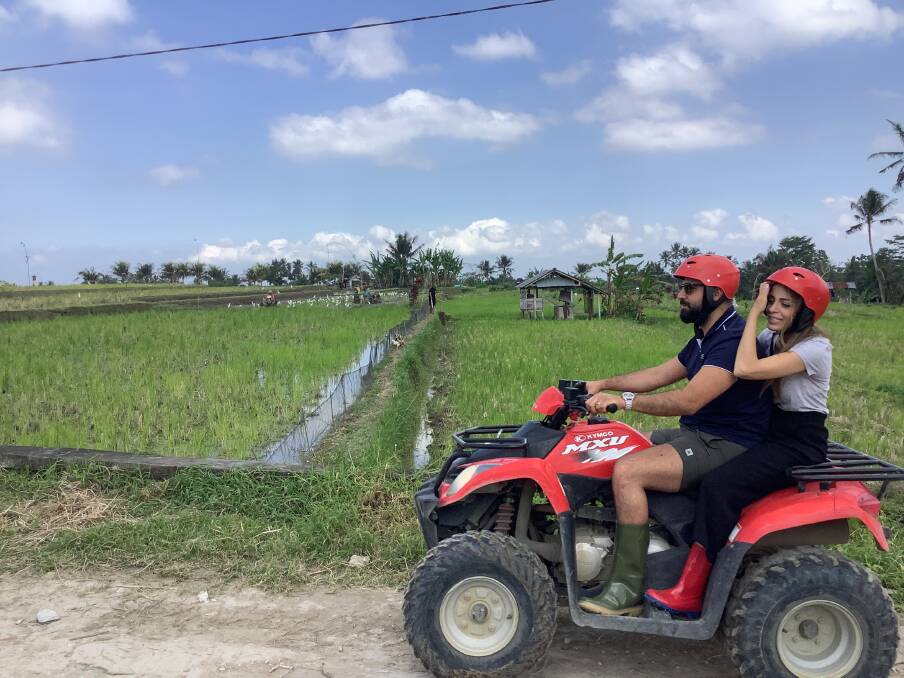 Tourists enjoy a quad-bike tour through the countryside near Ubud in Bali. Picture: Donna Page