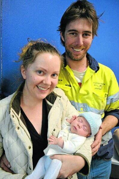 Eddison O’Connor with parents Bess and Andrew at 12-weeks-old.