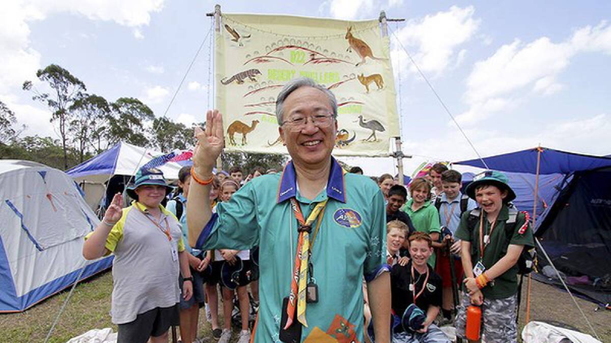 Scout leader Tomohide Sato from the 6th Ishinomaki Scout group in Japan - 400km north of Tokyo, 2 scouts from their group lost their lives in the 2011 Earthquake and Tsunami. He and four Japanese scouts came over with the help of the Australian and Japanese scouting organisations. He's pictured with scouts from the Hume region in NSW. Photo: Michelle Smith
