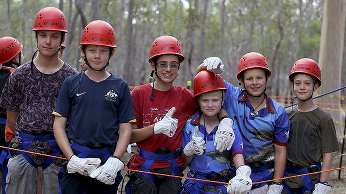 Gerry Wright, 12, Kailan Degnian, 13, Kyle Bennett, 13, Duncan Paterson, 11, Nicholas Rawson, 12, and Kael Walter, all from QLD, wait for their turn on the flying foxes. Photo: Michelle Smith